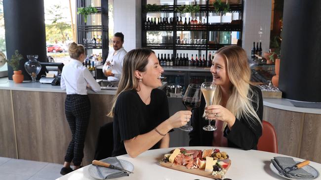 Crystalbrook Bailey opened a new boutique wine bar called Arte in July. Food and beverage manager Tiago Teixeira serves and organic wine to Laura Clark, while Jamie Binder and Jodie Walsh enjoy a drink and a charcuterie board together. Picture: Brendan Radke