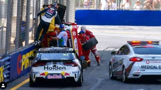 Emergency workers after Scott McLaughlin's crash.