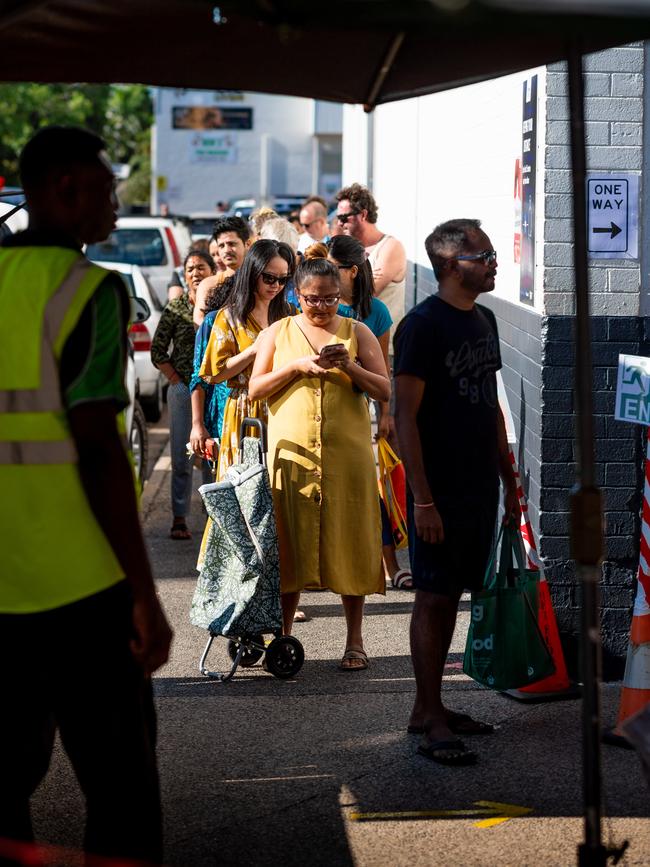 Shoppers now have to line up at Trower Rd to get into the Rapid Creek markets. Picture: Che Chorley