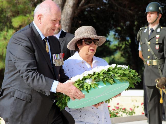 Tribute ... Australian Governor-General Sir Peter Cosgrove and his wife Lynne lay a wreath to soldiers of Turkey's 57th Regiment during a memorial to commemorate the 100th anniversary of the Battle of Lone Pine at Anzac Cove. Picture: AAP