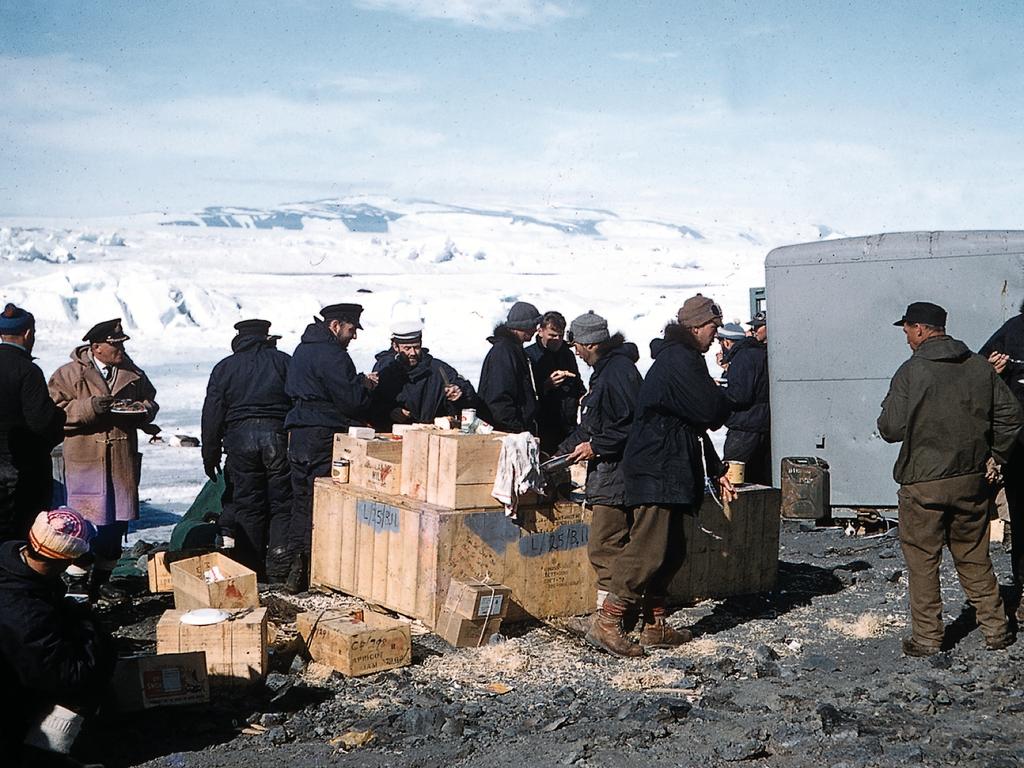 Members of the Commonwealth Trans-Antarctic Expedition, which included Prince Philip, take a meal break in a photo circa 1956-58. Picture: Supplied