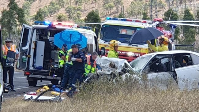 Emergency workers are battling midday heat as they try to help three seriously injured people