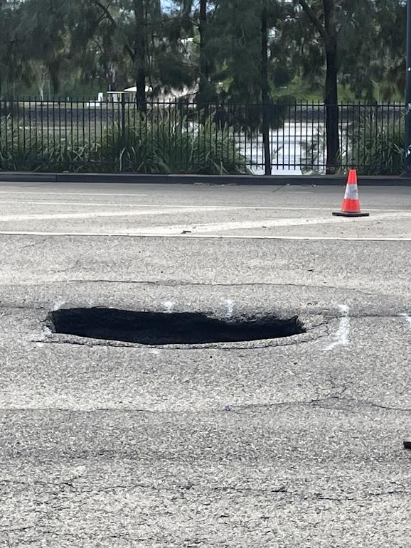 A sink hole that formed on Coronation Drive at Auchenflower on Thursday morning. Picture: Andreas Nicola