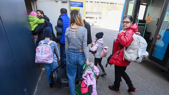 Ukrainians arrive at the Budapest Olympic Centre, where a new transit shelter for Ukrainian refugees has been installed. Picture: AFP