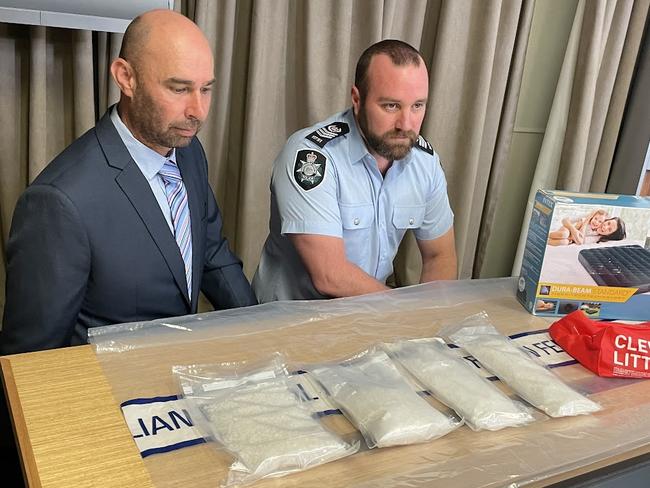 Tasmania Police’s Detective Acting Inspector Mathew Adams and the Australian Federal Police’s Detective Sergeant Aaron Hardcastle.