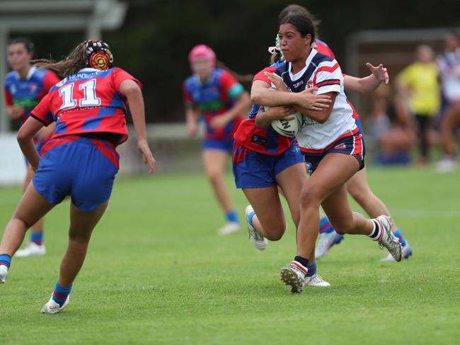 Mia Vaotuua runs hard at the line. Picture: Sue Graham