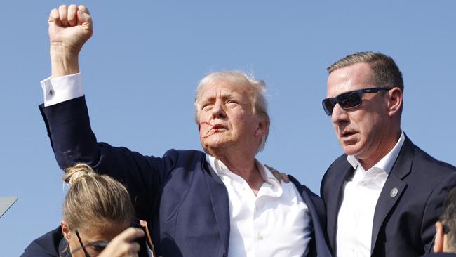 Former president Donald Trump is rushed offstage. Picture: Anna Moneymaker/Getty Images/AFP