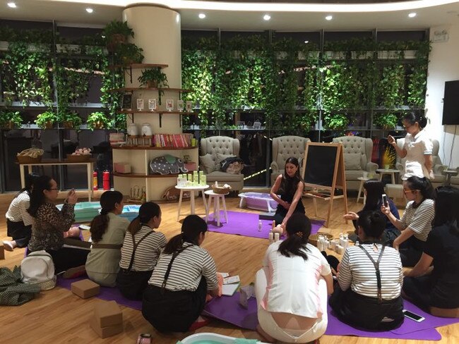 Catherine Cervasio, from Victoria, who founded and created a natural and organic baby skin care range called Aromababy. She is seen talking to new mothers in China. Pictures: Supplied 