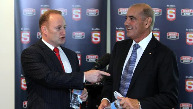 You the man? Crows chairman Rob Chapman and the-then SANFL chairman John Olsen at a 2011 press conference at the former AAMI Stadium.