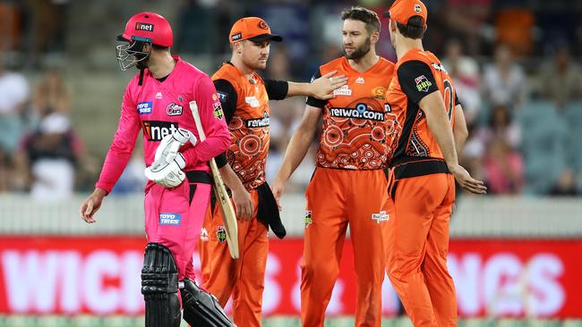 James Vince shows his frustration as he walks away from Andrew Tye after Tye bowled a wide that gave the Sixers the win and left Vince not out on 98. Picture: Mark Kolbe/Getty Images