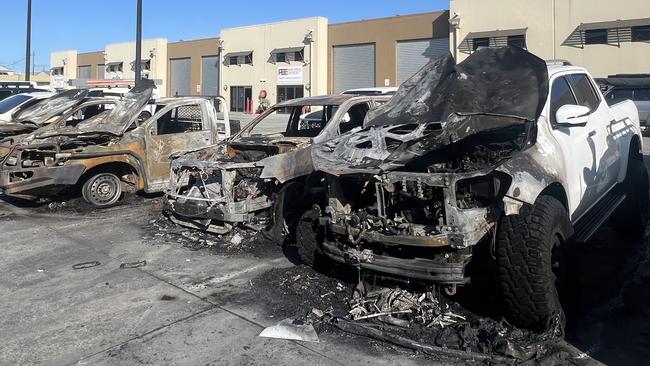Burnt out cars at a Biggera Waters business after a suspected arson attack. Picture: Keith Woods.