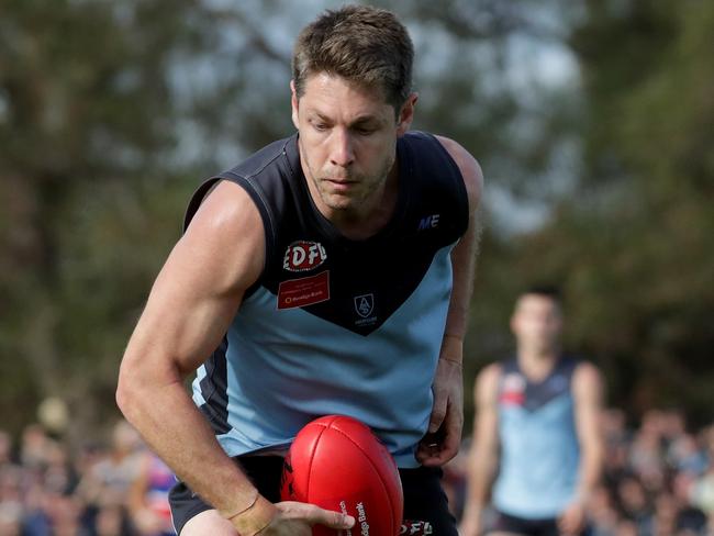 Luke Blackwell fires out a handball in last year’s EDFL grand final. Picture: Mark Dadswell/AAP