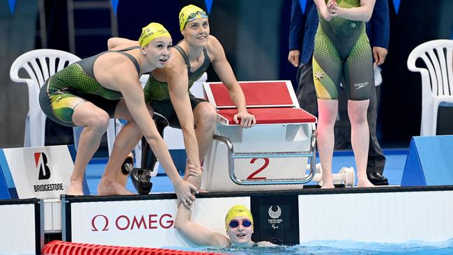 Vincent and her teammates look to the results after she brought home bronze for the country. Picture: Supplied / Swimming Australia