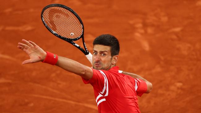 World No.1 Novak Djokovic celebrates after match point against Matteo Berrettini at Roland Garros