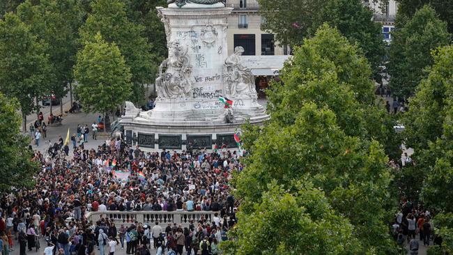 Demonstrators gather around the Monument a la Republique as they take part in a rally after the announcement of the results of the first round of French parliamentary elections. Picture: AFP.