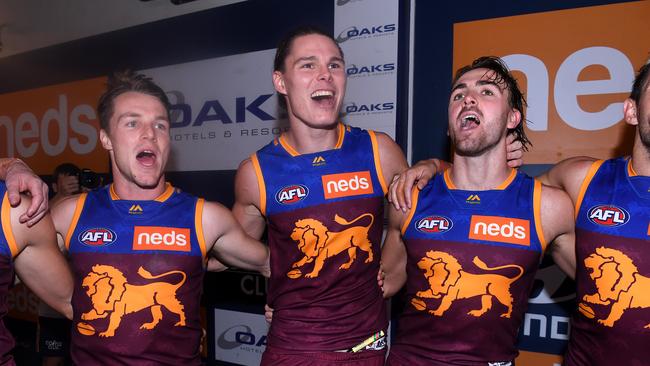 Eric Hipwood and the Lions sing the team song. Pic: AAP 