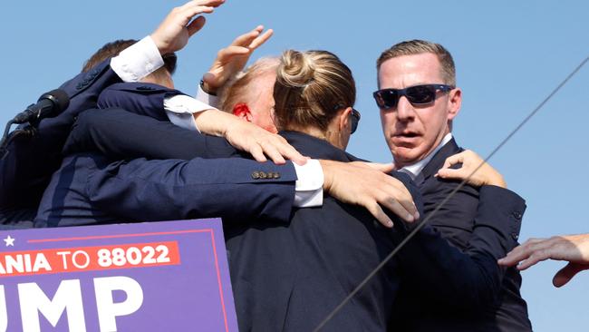 Secret Service agents surround Mr Trump after the shooting in Butler. Picture: Anna Moneymaker/Getty Images via AFP