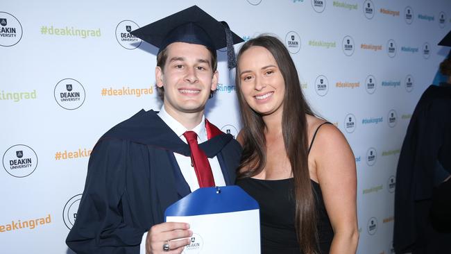 Joshua Knight and Sophie Scott celebrate graduation. Picture: Alan Barber