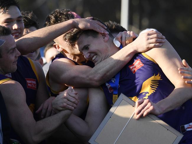 Andrew Ainger is swamped by teammates after being named the Cliff Tomkins/Blue Ribbon medallist. Picture: Andy Brownbill