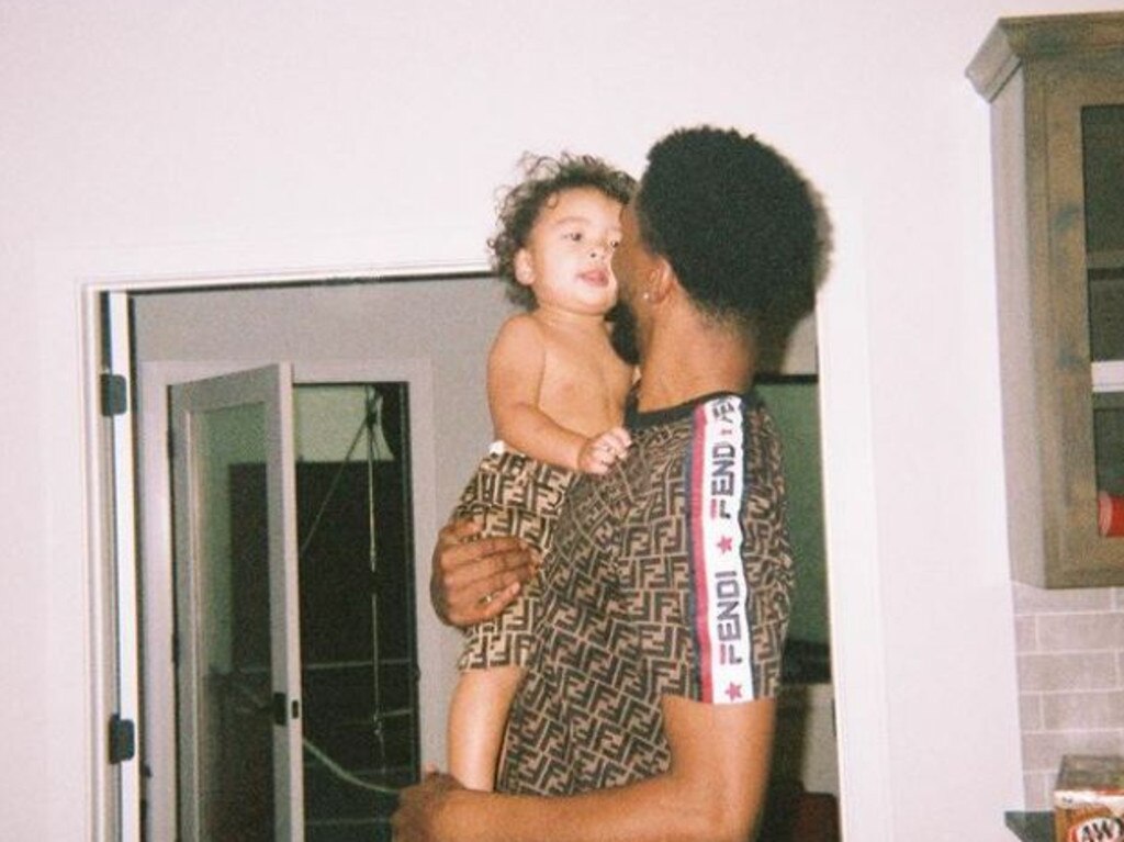 Malik Beasley with his one-year-old son.