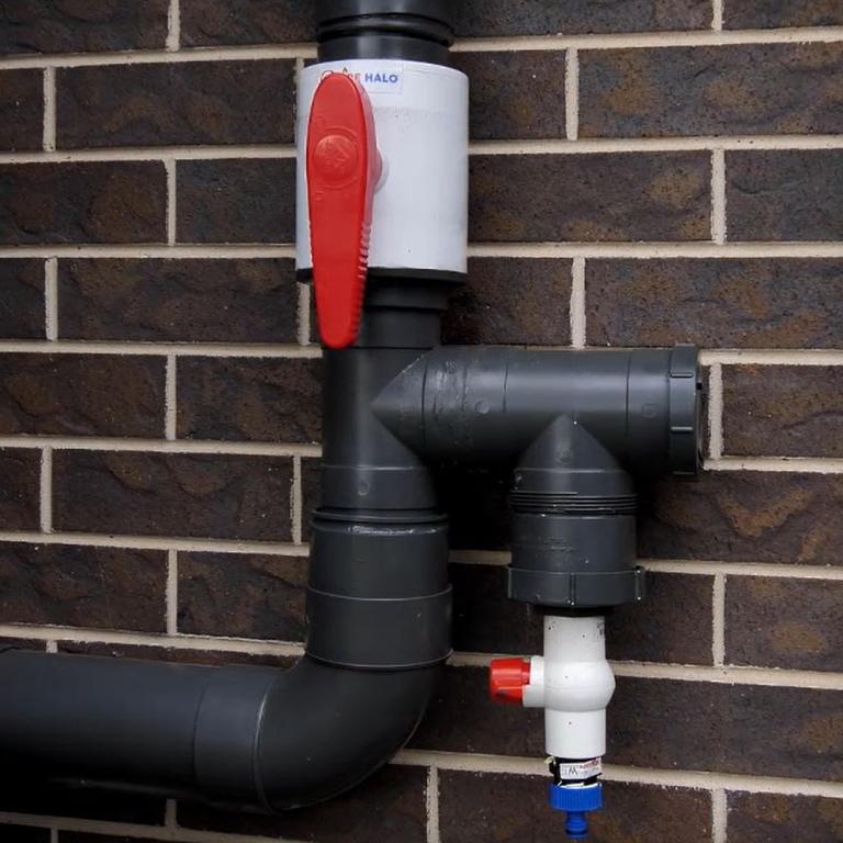 Fire Halo connects to a feeder pipe, which is connected to every downpipe on a house, and then to a water tank or mains water supply via a garden hose.