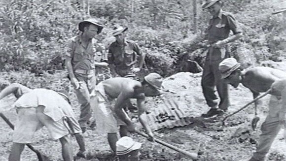 Batumerah, Ambon: Japanese prisoners of war digging for possible grave sites in 1945. Source: Australian War Memorial