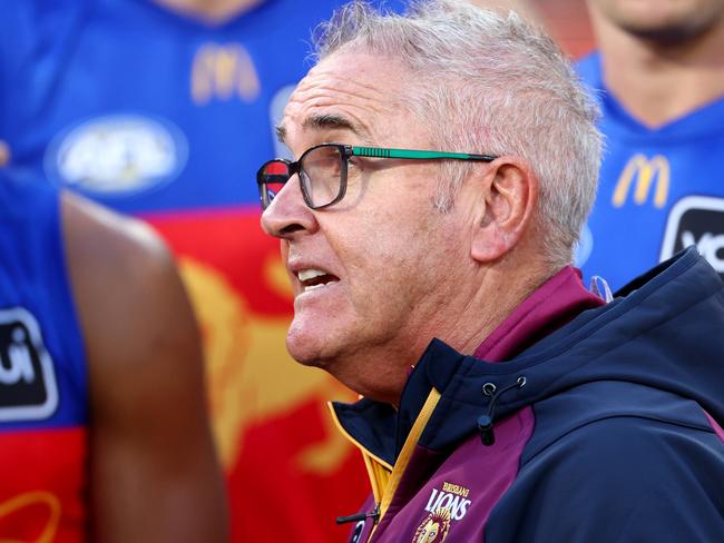 MELBOURNE, AUSTRALIA - APRIL 05: Chris Fagan, Senior Coach of the Lions speaks to his players during the round four AFL match between Richmond Tigers and Brisbane Lions at Melbourne Cricket Ground, on April 05, 2025, in Melbourne, Australia. (Photo by Josh Chadwick/AFL Photos/via Getty Images)