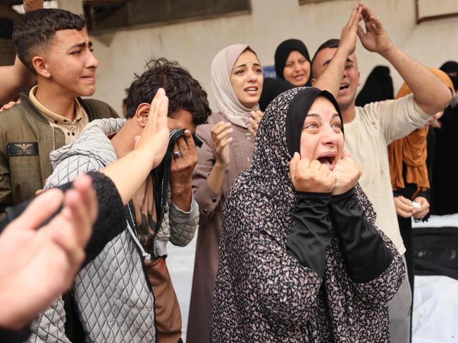 Palestinians mourn relatives killed in Israeli bombardment, at the al-Najjar hospital in Rafah in the southern Gaza Strip, on April 29, 2024 amid the ongoing conflict between Israel and the Palestinian militant group Hamas. (Photo by AFP)