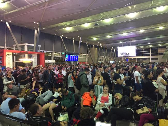 Passengers slump in chairs waiting for news at T2 Terminal. Picture: Twitter @KatherineGriffo