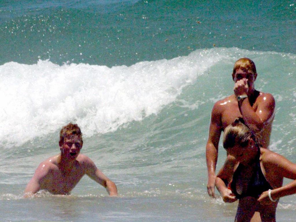 Prince Harry, on left, told the High Court he was hounded by press while at the beach during his visit to Australia.