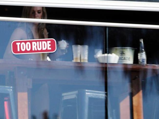 Topless waitress cleans up.