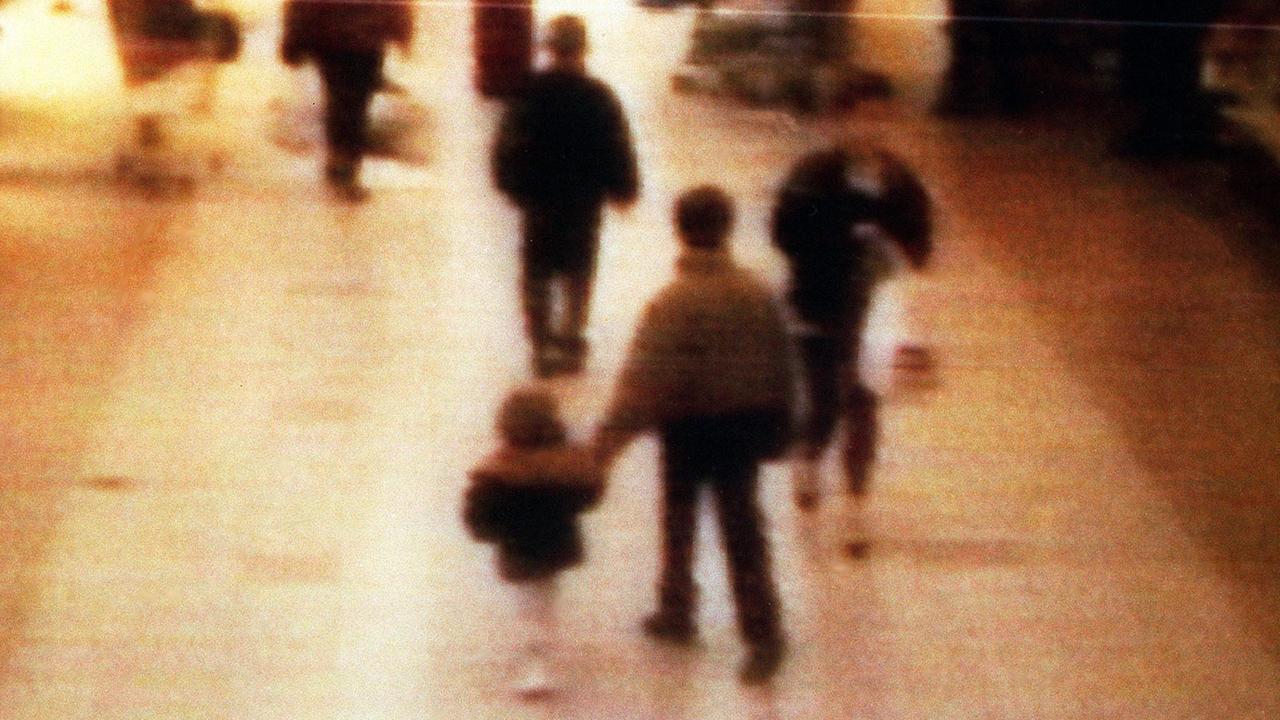 A surveillance camera shows James Bulger being led to his death by Jon Venables. Picture: BWP Media via Getty Images