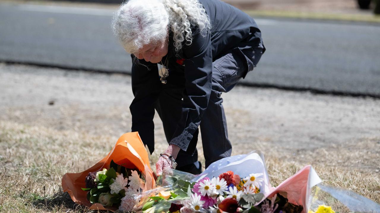 Goolwa local Dianne Campbell leaves flowers on Beach Road where Charlie Stevens was struck by a car. Picture: Morgan Sette