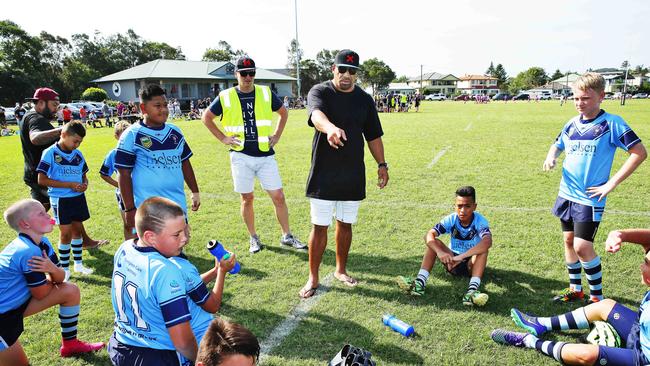 John Hopoate, chats with the Beacon Hill Rugby League during half time as they play against the Narrabeen Sharks at Lakeside Park, Narrabeen. Picture: Braden Fastier