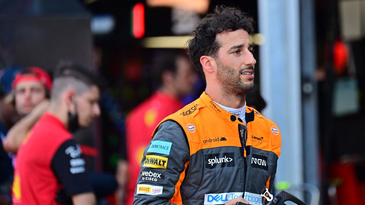 McLaren's Australian driver Daniel Ricciardo returns to the pit lane after a crash during the second practice session at the Monaco street circuit. (Photo by ANDREJ ISAKOVIC / AFP)