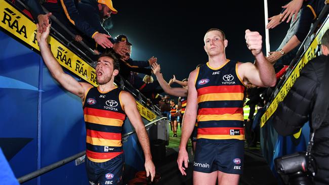 Richard Douglas and Sam Jacobs celebrate the Crows’ win against the Eagles. Picture: AAP Image/Mark Brake