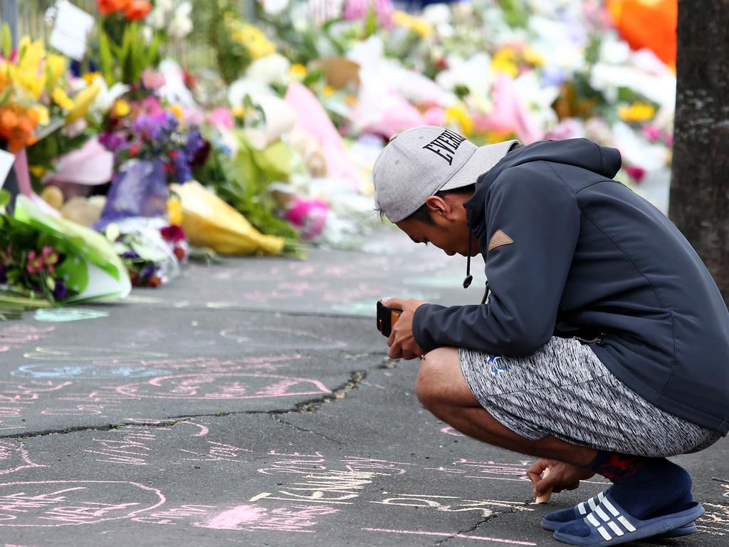 Locals lay flowers and condolences at the Huda Mosque in tribute to those killed and injured at the Al Huda Mosque on March 16, 2019 in Dunedin. Picture: Dianne Manson/Getty Images