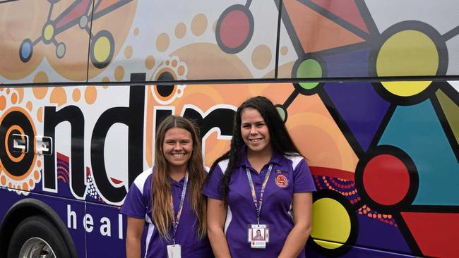 READY TO ROLL: Goondir Health Services employees Mardi-Leigh Rolls and Charlie Thomas in front of the clinics bus. Picture: Sam Flanagan