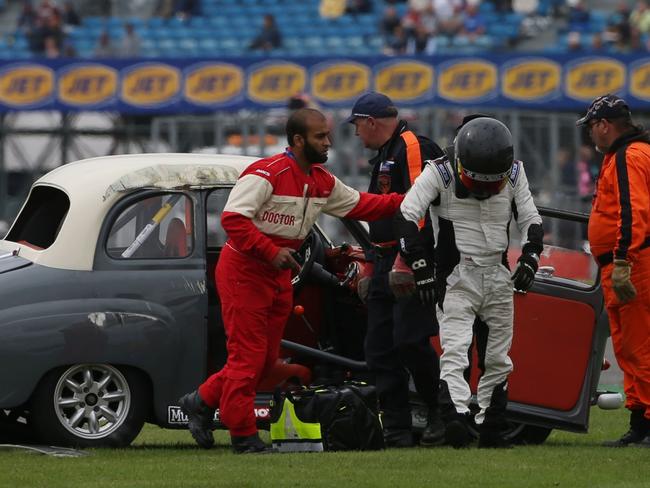 Rock on...  Brian Johnson walks away unscathed from the bender. Picture: Splash News.