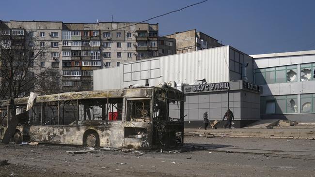 A heavily damaged building and a wrecked bus are seen as civilians are being evacuated along humanitarian corridors from the Ukrainian city of Mariupol. Picture: Getty Images