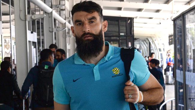 Socceroos captain Mile Jedinak arrives back in Sydney on Sunday following the flight from Honduras.