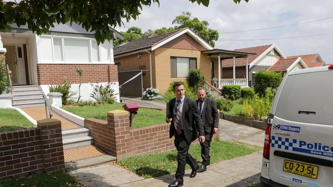 Detectives leave the Ashbury property where Marjorie Welsh was attacked.