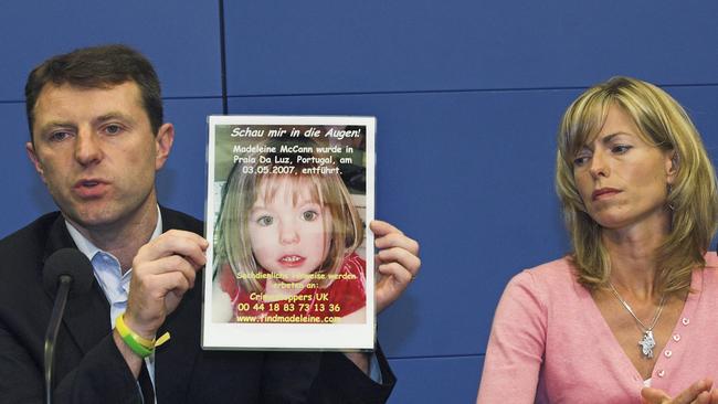 Gerry, left, and Kate McCann, parents of four-year old Madeleine McCann, present a picture of their daughter after her disappearance in 2007.