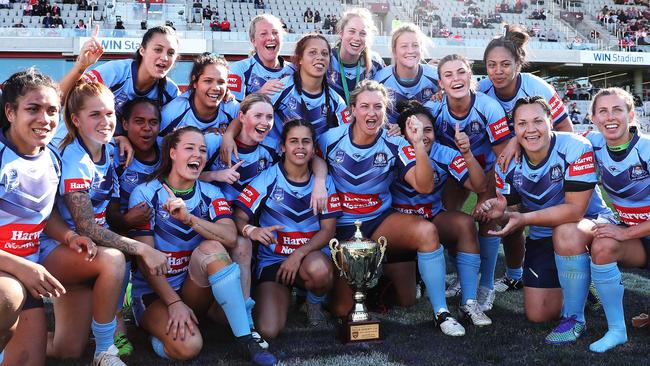 NSW celebrating their victory over Queenslands at the Interstate Challenge.