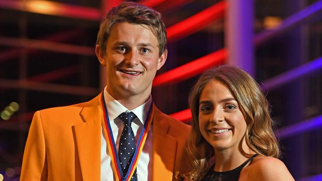 Matt Crouch, with partner Ellie Symons, after becoming the Crows’ second youngest club champion winner in October. Picture: Tom Huntley