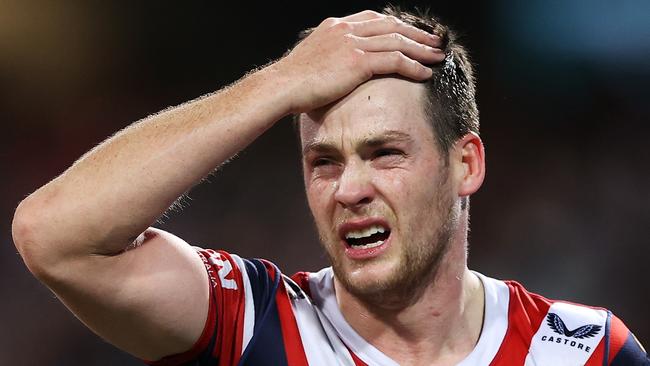 SYDNEY, AUSTRALIA - JUNE 11: Luke Keary of the Roosters holds his head as he leaves the field for an Head Injury Assessment  during the round 14 NRL match between the Sydney Roosters and the Melbourne Storm at Sydney Cricket Ground, on June 11, 2022, in Sydney, Australia. (Photo by Mark Kolbe/Getty Images)