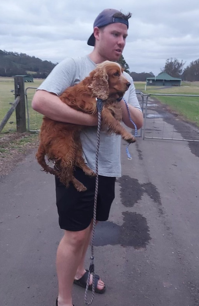 A relieved Lachlan Carter, of Grasmere, with Goldie, minutes after she was found in a horse stable along Cuthill Rd, Cobbity. Picture: Supplied