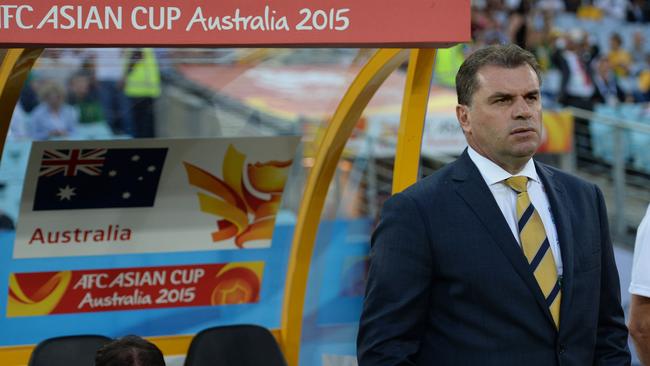 Australia's coach Ange Postecoglou looks on before their game against Oman in their Group A football match at the AFC Asian Cup in Sydney on January 13, 2015. AFP PHOTO / Peter PARKS --IMAGE RESTRICTED TO EDITORIAL USE - STRICTLY NO COMMERCIAL USE