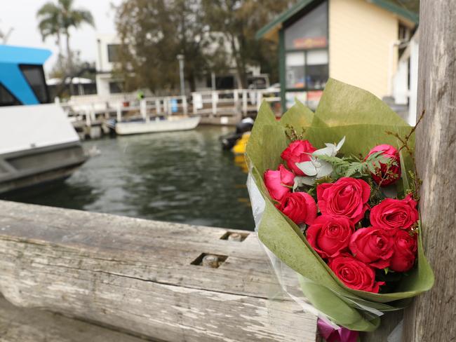 A bunch of roses left at Church Point Wharf in memory for Kassandra, who died in a boating accident. Picture: John Grainger