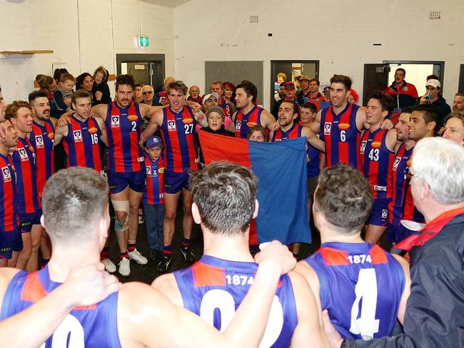 Port Melbourne sings the song after defeating Coburg. Pic: Jenny Tserkezidis